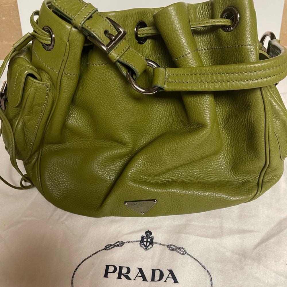 Brand New PRADA bucket bag in olive green leather. Retails for $1,095.00